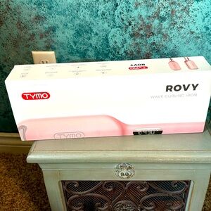 Tump wave curling iron, never used: too big for my head and hair.